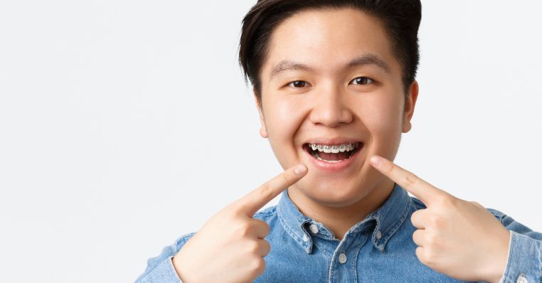 A boy with braces smiling